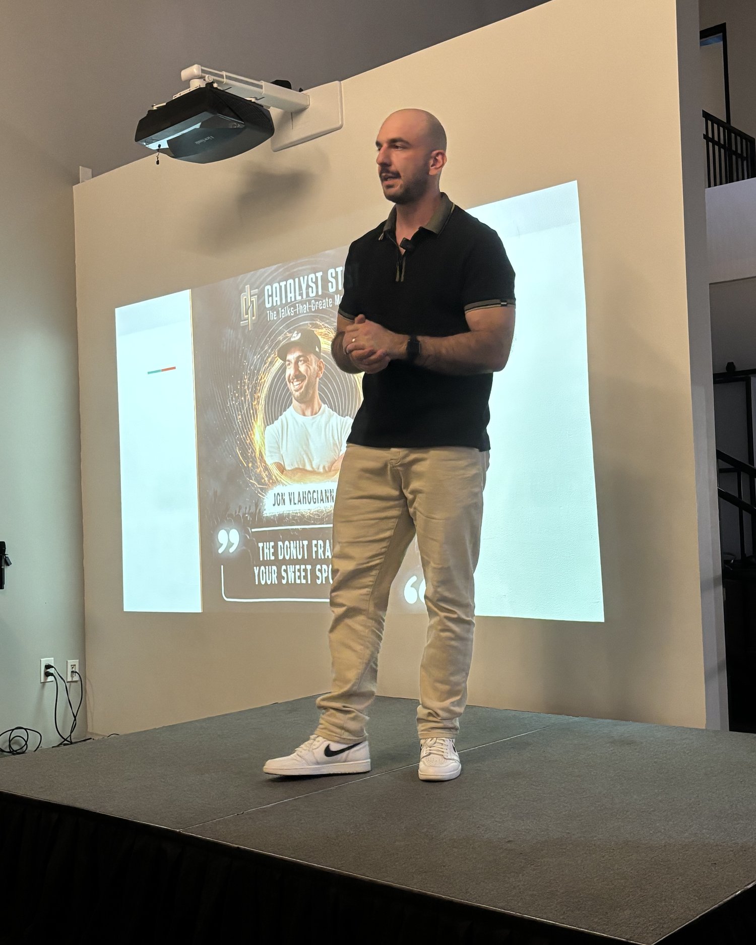 Jon speaking on stage